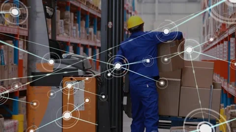 Warehouse worker pushing pallet jack past forklift while data overlay tracking Stock Footage 320089136