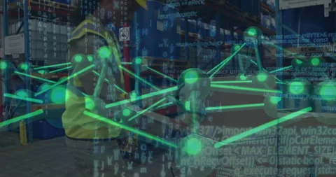 Warehouse worker retrieving scanner and scanning boxes with data flow overlay Stock Footage 310325658