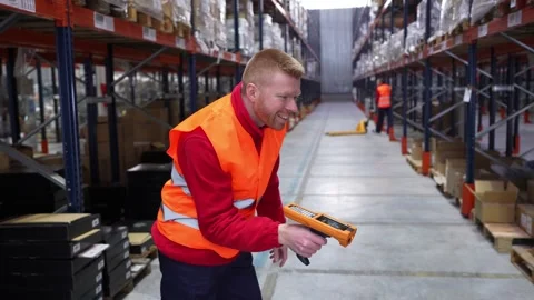 Warehouse worker scanning and dancing with barcode scanner Stock Footage 312856331