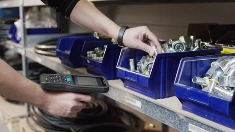 Warehouse Worker Scanning Barcode on Blue Parts Bins, Inventory Stocktaking Stock Footage 340358393