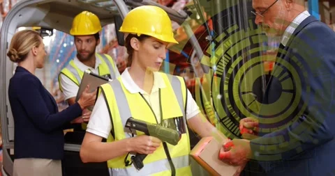 Warehouse worker scanning box after handoff for inventory tracking while data Stock Footage 319681611