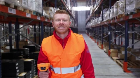 Warehouse worker scanning inventory with barcode scanner Stock Footage 312856348