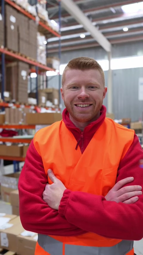 Warehouse worker smiling with crossed arms Stock Footage 312856458
