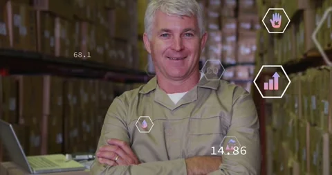 Warehouse worker standing, laptop sending data, hex icons moving over chest, Stock Footage 334115500