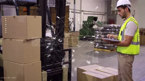 Warehouse worker tapping laptop, showing data overlay between him and forklift, Stock Footage 335761690