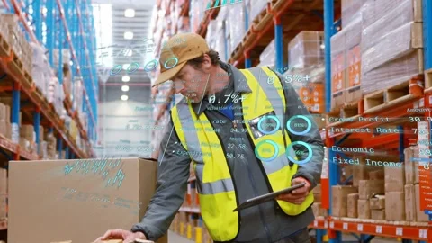 Warehouse worker tapping tablet and reading AR data, leaning to inspect box and Stock Footage 333425834