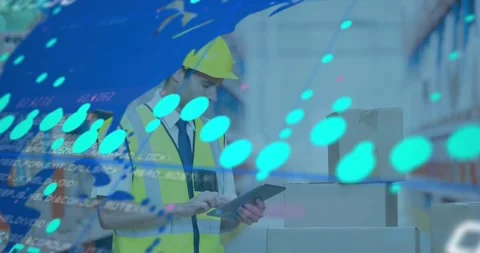 Warehouse worker tapping tablet, blue HUD expanding and mapping stock data onto Stock Footage 330958767