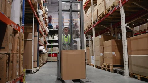 Warehouse Worker Transporting Goods with Forklift Video stock 294265757