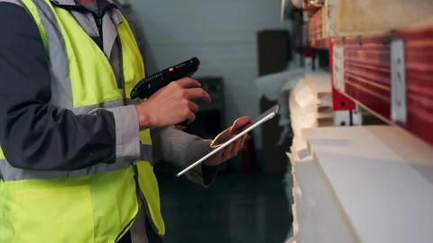 Warehouse Worker Using Barcode Scanner and Tablet for Inventory Control Stock Footage 345013054
