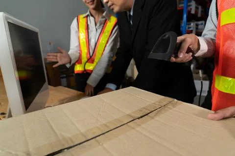 Warehouse worker using barcode scanner in storehouse Stock-Fotos