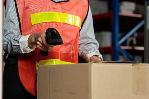 Warehouse worker using barcode scanner in storehouse Stock Photos