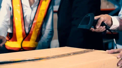 Warehouse worker using barcode scanner in storehouse Stock-Fotos