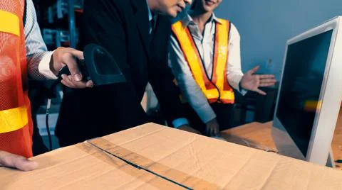 Warehouse worker using barcode scanner in storehouse Stock-Fotos
