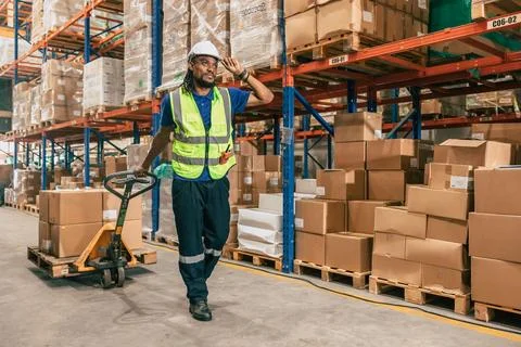 Warehouse worker using parcel pallet in cargo shipping logistics ship suppl.. Stock Photos