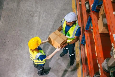 Warehouse worker work in shipping logistics factory ship supply order goods.. Stock Photos