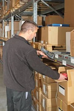 Warehouse Worker Worker in Warehouse With Portable Barcode Scanner ,model ... Stock-Fotos