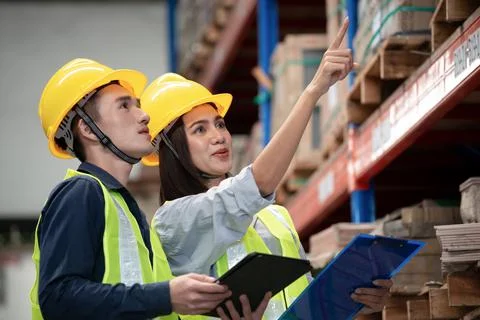 Warehouse worker working together in warehouse Stock Photos