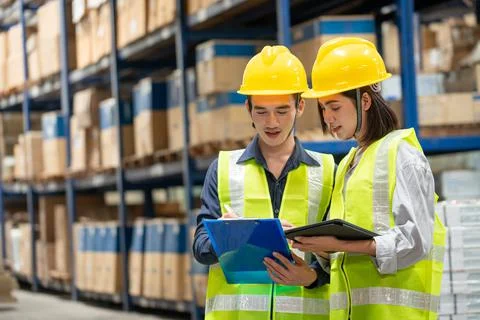Warehouse worker working together in warehouse Stock Photos