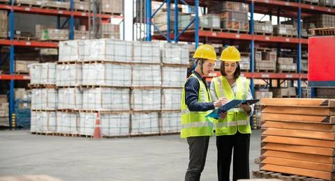 Warehouse worker working together in warehouse Stock Photos