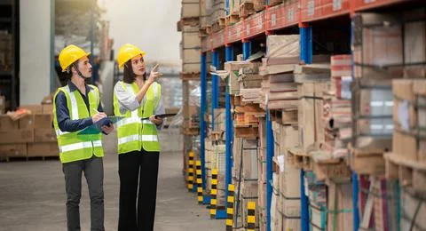 Warehouse worker working together in warehouse Stock Photos