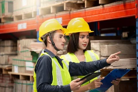 Warehouse worker working together in warehouse Stock Photos