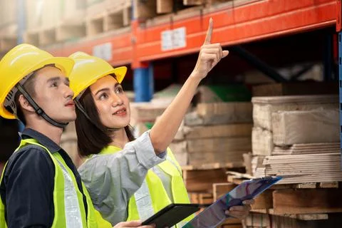 Warehouse worker working together in warehouse Stock Photos