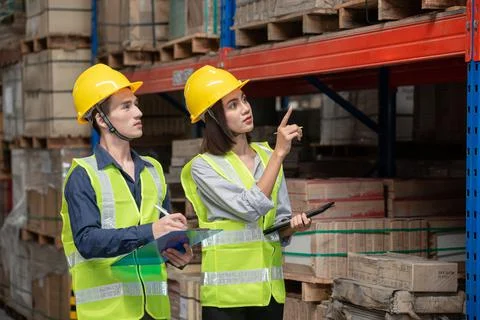 Warehouse worker working together in warehouse Stock Photos