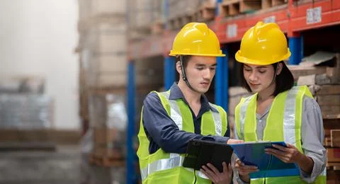 Warehouse worker working together in warehouse Stock Photos