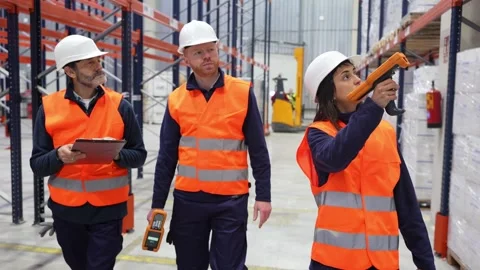 Warehouse workers checking inventory with barcode scanners Stock Footage 312856401