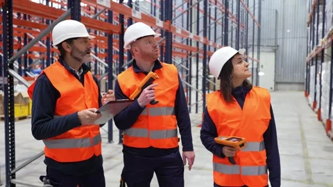Warehouse workers checking inventory with barcode scanner Stock Footage 312856402