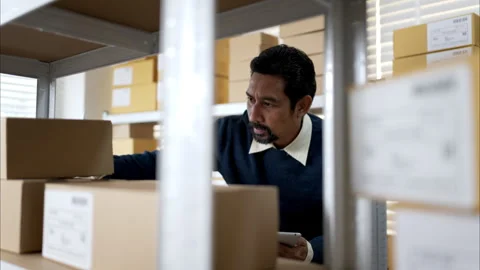 Warehouse workers checking inventory on shelves using tablet Stock Footage 326277821