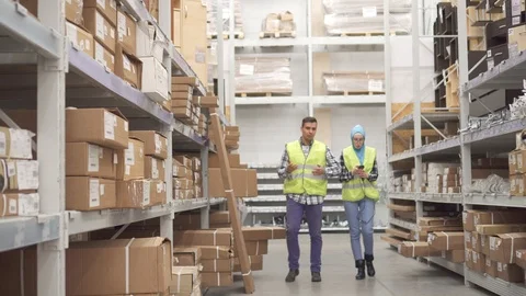 Warehouse workers communicate and carry out accounting scanner barcode Stock Footage 100877104