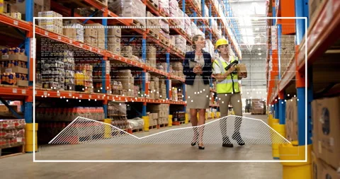 In warehouse, workers discussing inventory using animation for data Stock Footage 304202270