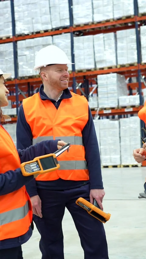 Warehouse workers discussing logistics and inventory management Stock Footage 305647465
