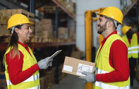 Warehouse workers doing inventory using digital tablet Stock Photos