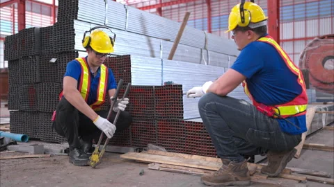 Warehouse workers in hard hats and helmets Video stock 260154630