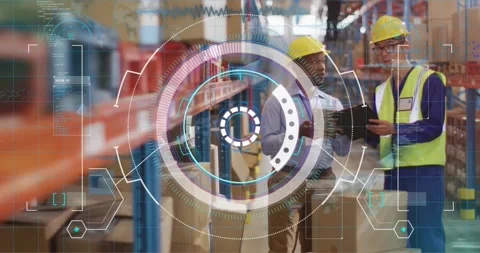 In warehouse, workers in hard hats viewing animation of logistics data overlay Stock Footage 329920695