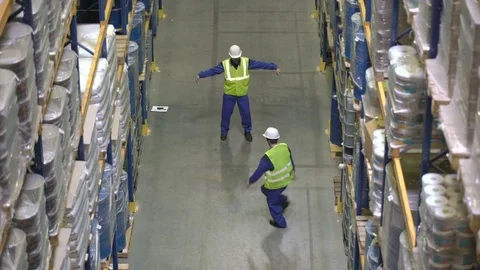 Warehouse workers have dance battle during break Stock Footage 76019666