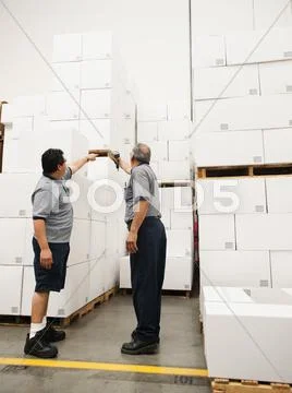 Warehouse workers scanning delivery Stock Photos