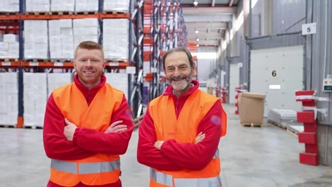 Warehouse workers smiling with arms crossed Stock-Footage 312856359