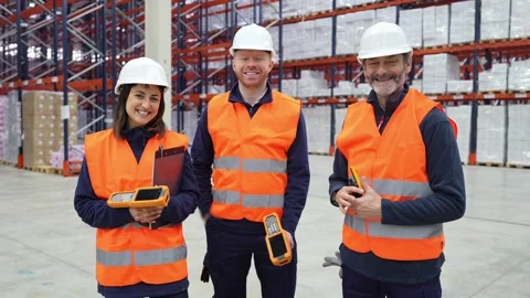 Warehouse workers smiling at camera Stock Footage 312856391