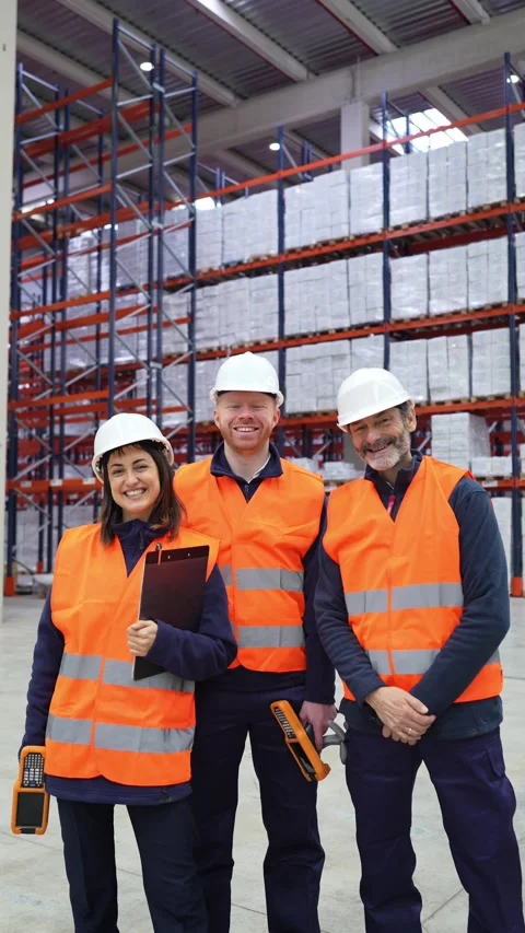 Warehouse workers smiling at camera Stock Footage 312856504