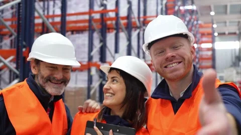 Warehouse workers taking a selfie Stock Footage 312856397