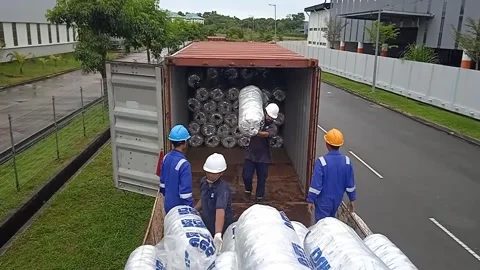 Warehouse Workers Unload Imported Goods From Containers To Trucks Outdoors Stock Footage 304963510