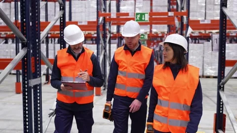 Warehouse workers walking and talking Stock-Footage 312856413