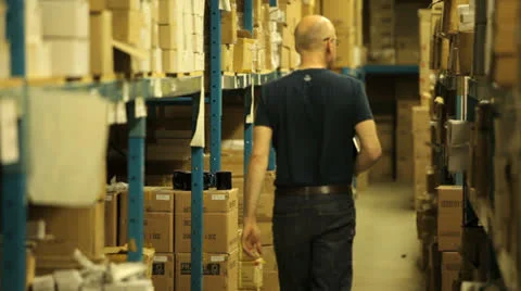 Warehouseman taking stock Stock Footage 22917796