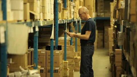 Warehouseman taking stock Stock Footage 22917881