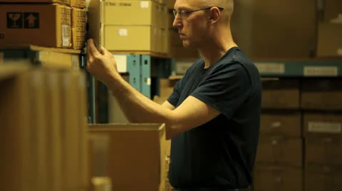 Warehouseman taking stock Stock Footage 22917979