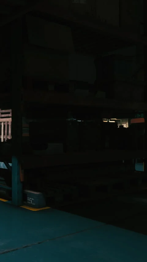 Warehouses hold various items at night in quiet surroundings Stock Footage 338413625