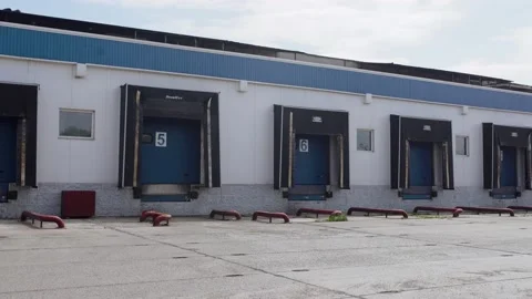 Warehouses ramps for loading and unloading goods on the big logistics park. Video stock 138591532